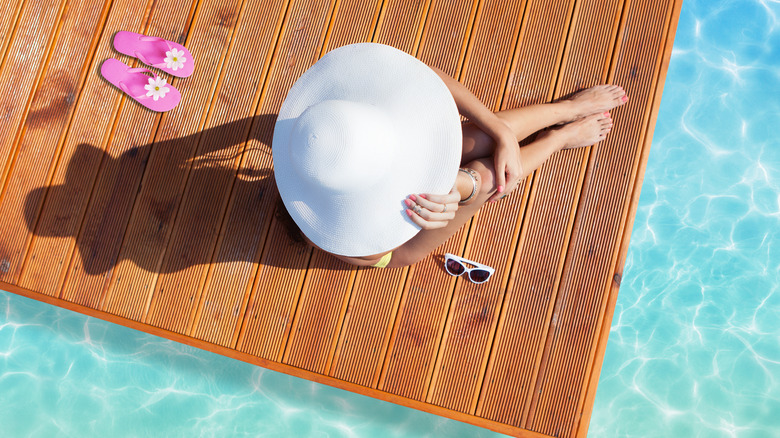 Woman sitting in the sun wearing jewelry