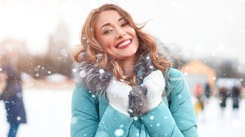 Woman wearing gloves and winter attire