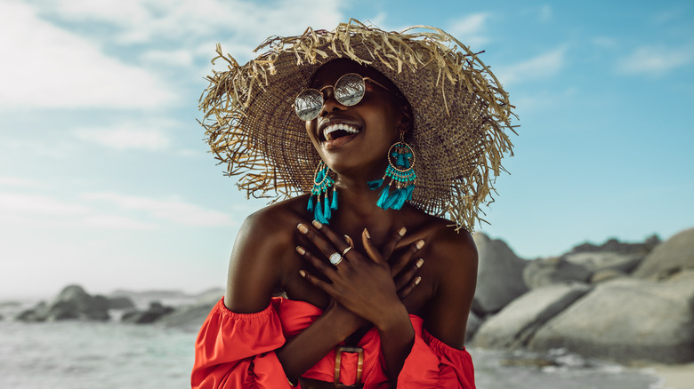 Black woman with a straw hat