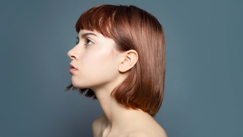 Woman with bob haircut looking up