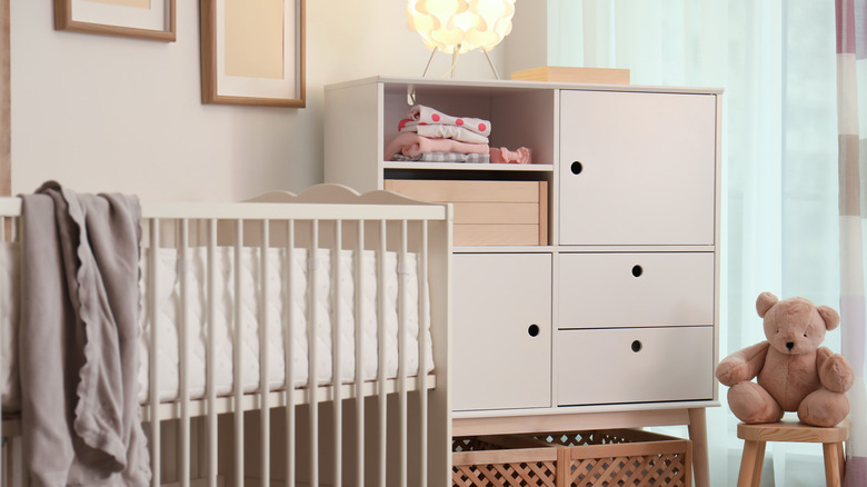 Corner of room with crib and storage