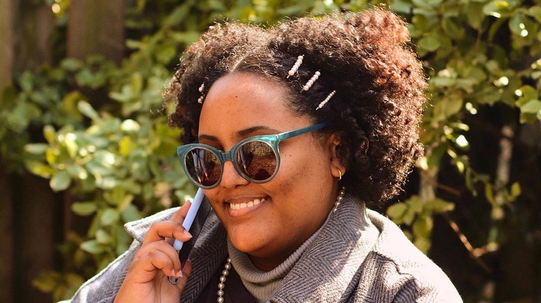 Curly Afro hair with barrettes