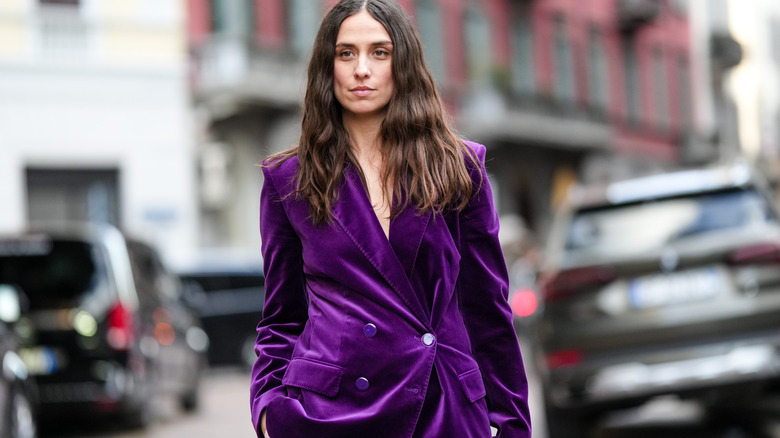 Woman wearing dark purple velvet oversized blazer