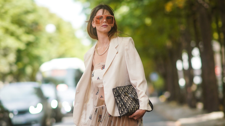 Woman wearing oversize blazer over maxi skirt