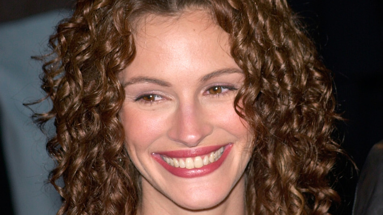 Julia Roberts smiling with curly hair