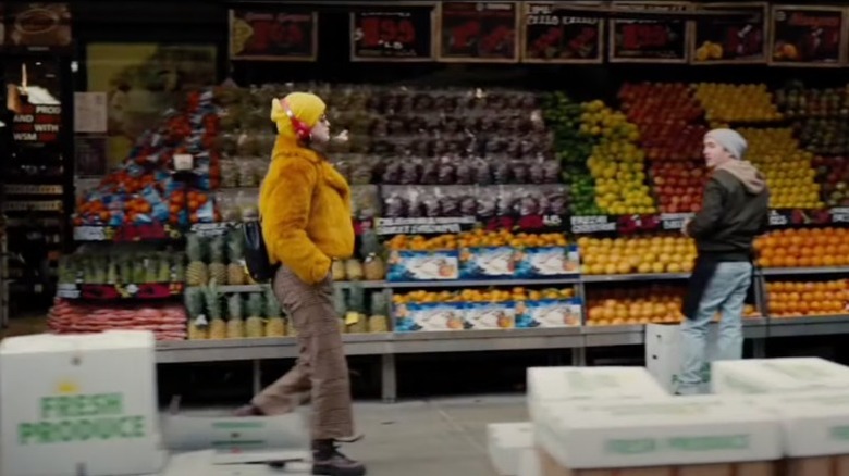 Selena Gomez as Mabel walking past fruitstand