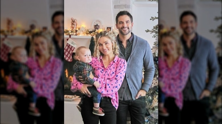 Clare Bowen and Brant Daugherty posing with baby