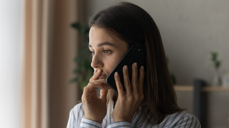 contemplative woman on phone call