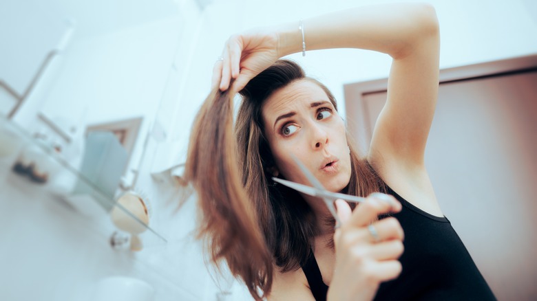 woman about to cut her hair