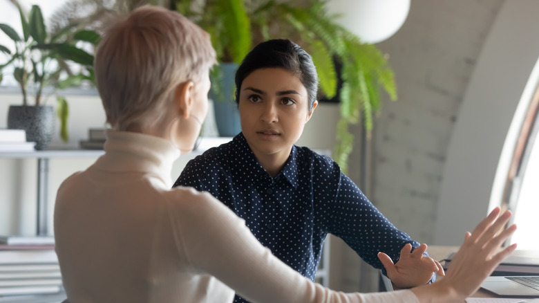 Two woman having serious discussion