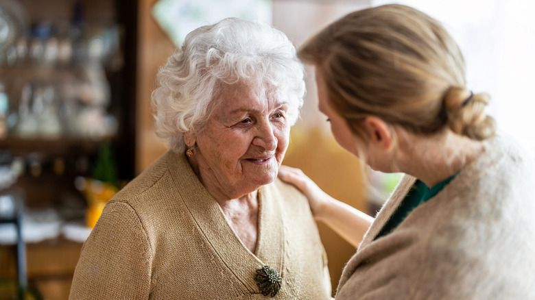 Social worker with elderly patient