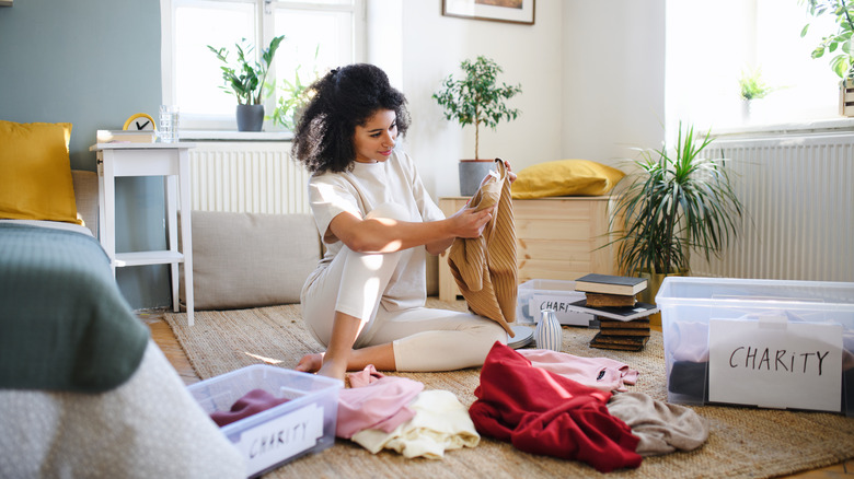 person sorting clothes