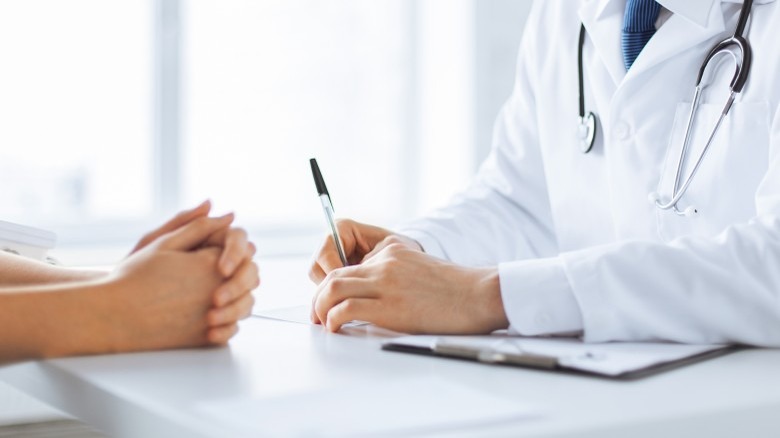 woman talking to doctor