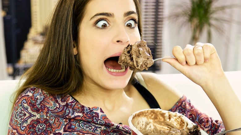 woman eating chocolate ice cream while pregnant