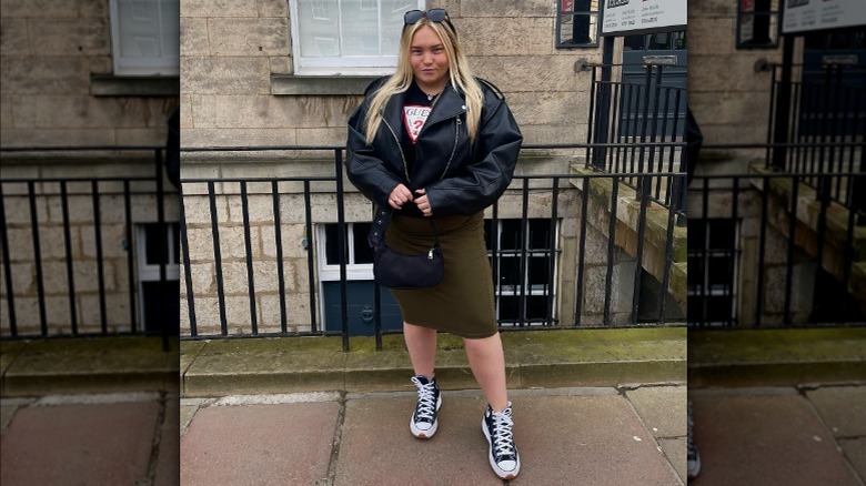 woman wearing pencil skirt with leather jacket