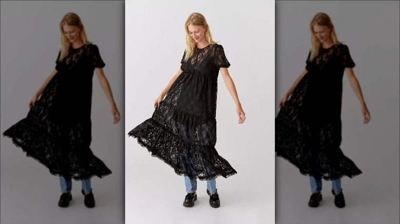 Urban Outfitters model layers sheer dress over jeans