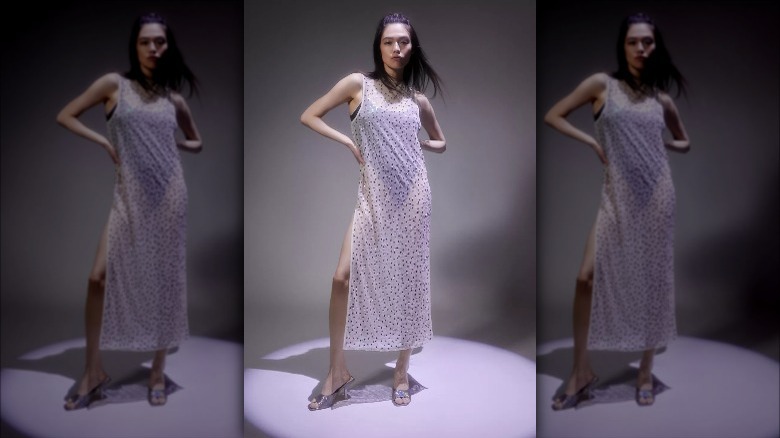 Urban Outfitters model wears sheer bedazzled dress