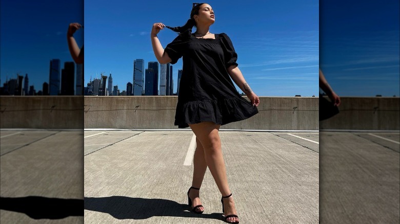 woman on roof top in black dress