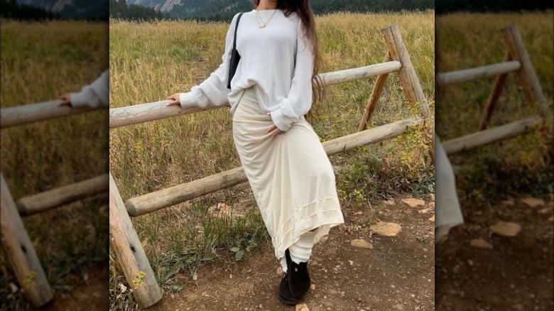 girl in long skirt in mountains