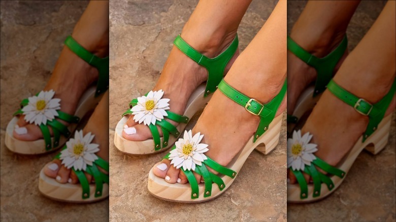 Green strappy sandals with white flower