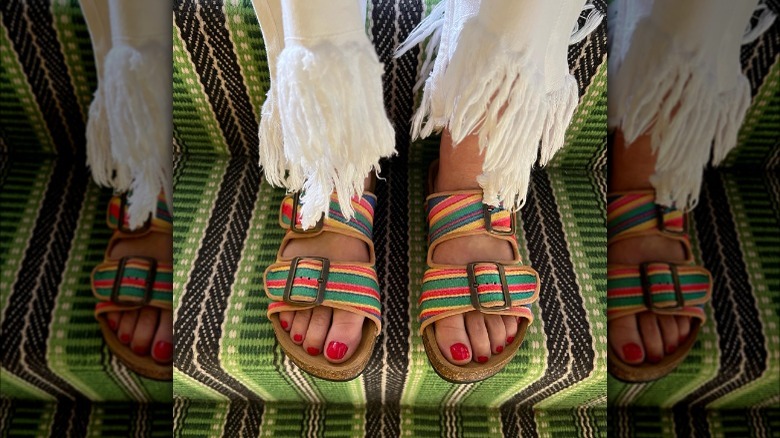 person wearing brightly colored sandals