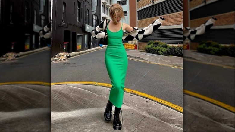 woman in green dress and boots