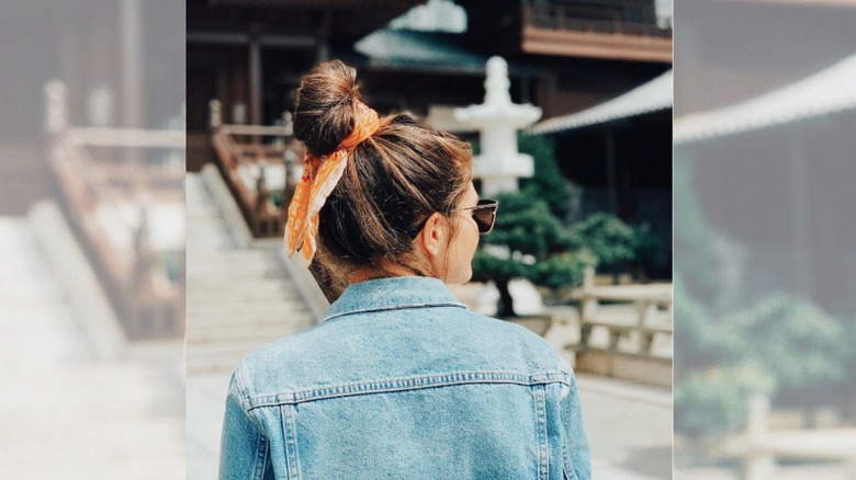 Woman wearing hair in bun with bandana