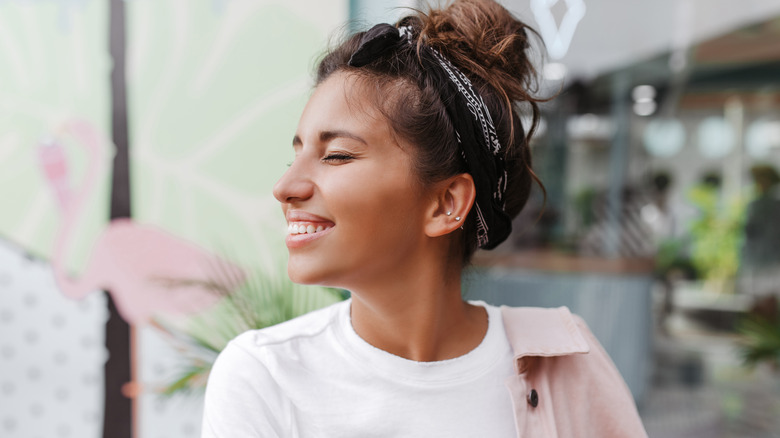 Woman wearing bandana and messy bun