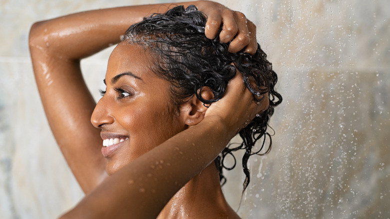 Woman washing her hair in the shower