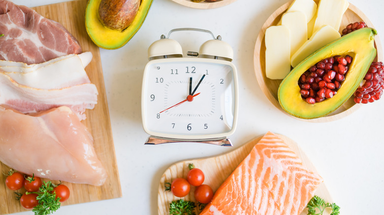 A clock surrounded with food