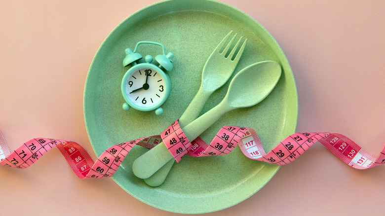 Tape measure, clock on plate