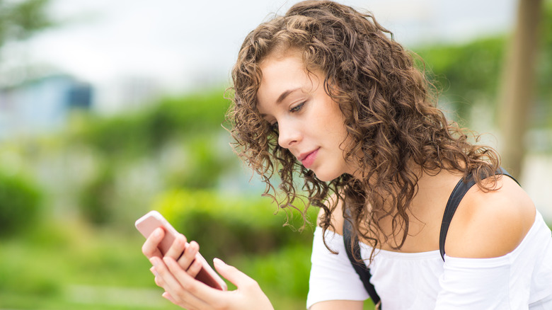 woman looking at phone 