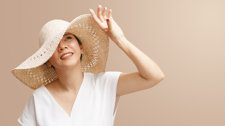 A woman wearing a sun hat