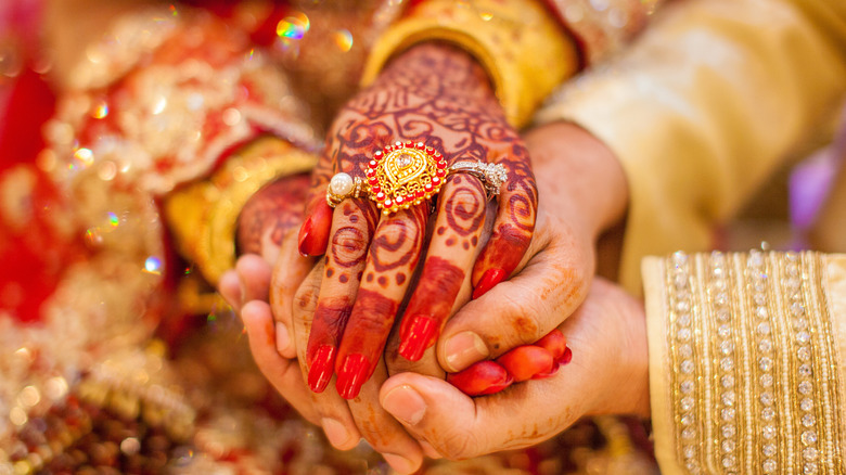 A woman wearing an engagement ring in the Hindu ceremony