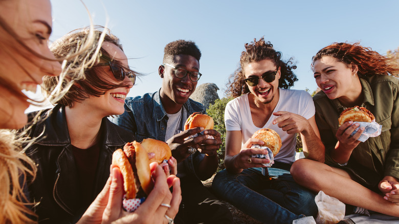 friends smiling and eating together