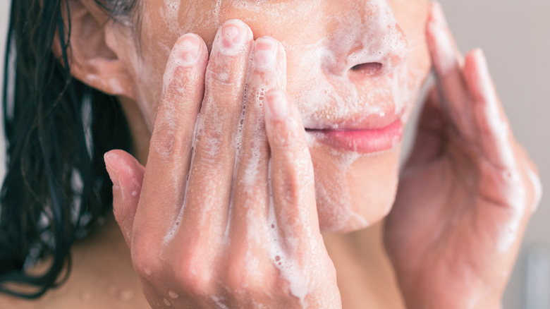woman washing face 
