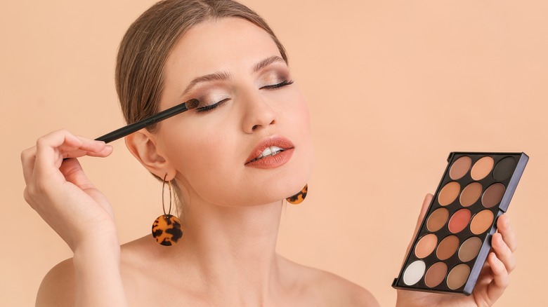 Woman applying eyeshadow