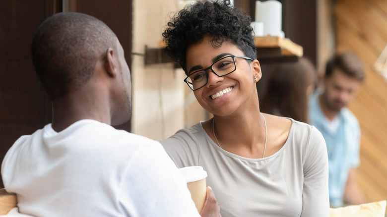 Man and woman smiling on date