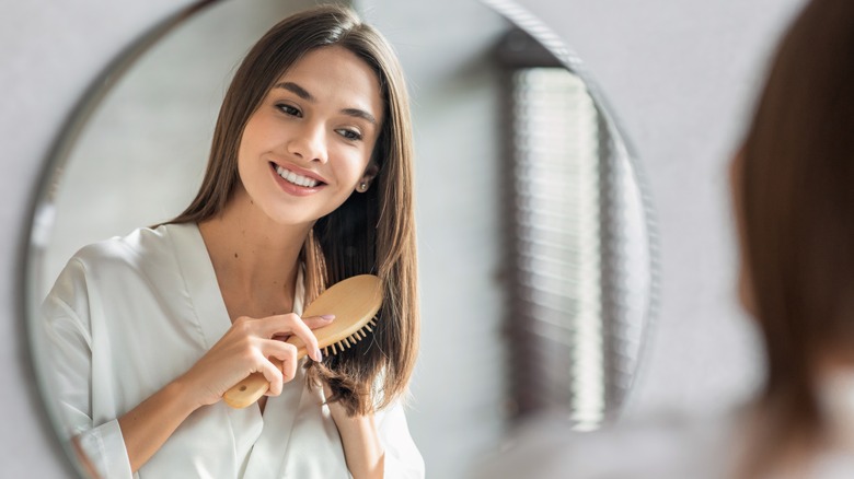 A woman brushing her hair