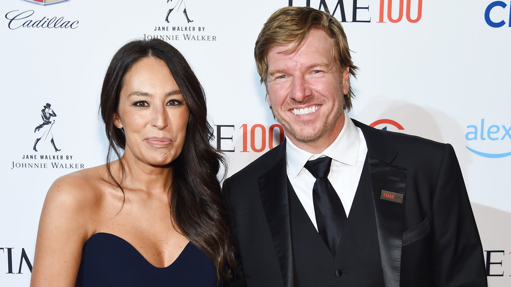 Chip and Joanna Gaines smile at event