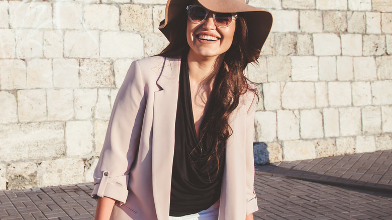 Woman in hate and casual blazer