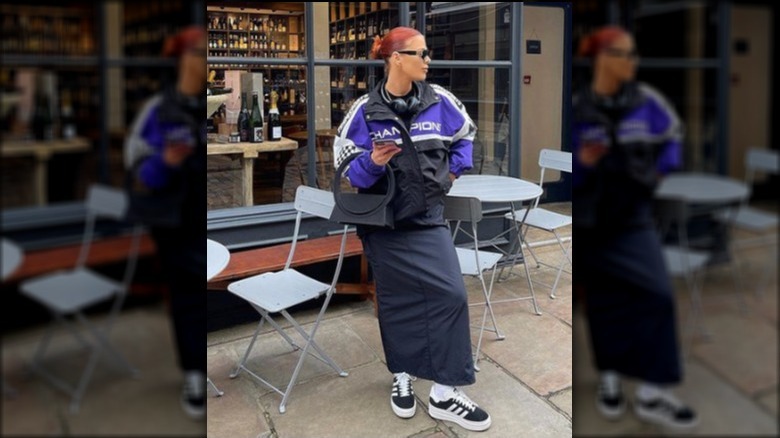 Woman in maxi skirt and platform sneakers