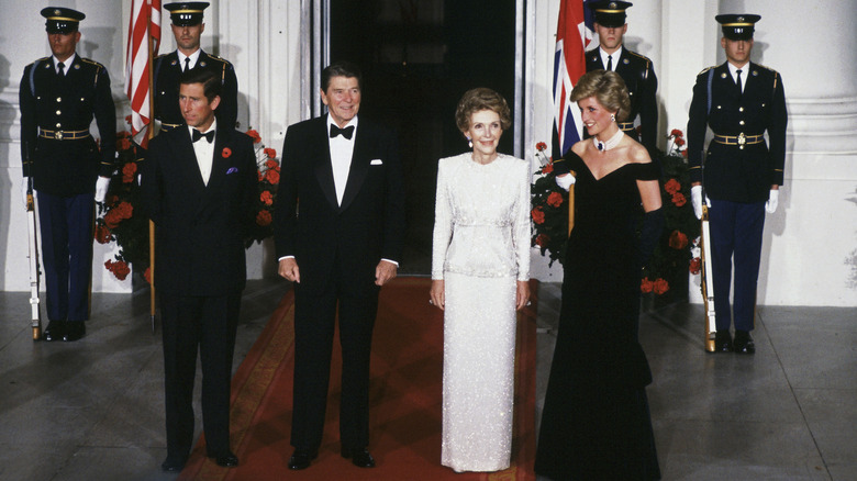 Prince Charles, Ronald Regan, Nancy Regan, and Princess Diana standing together at the White House