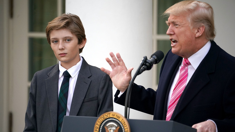 Barron and Donald Trump at a podium