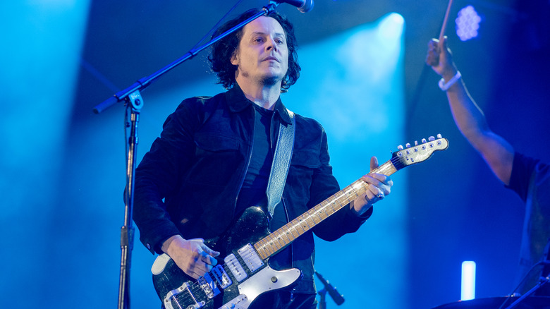 Jack White playing on stage