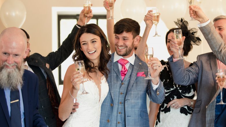 guests toasting the bride and groom