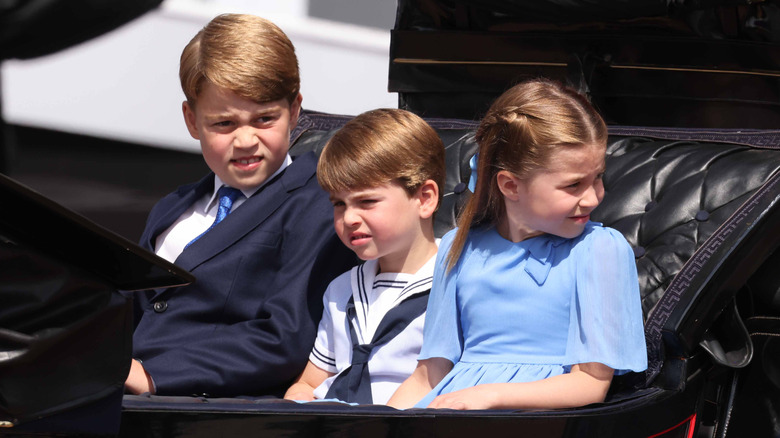 Prince George with siblings in carriage