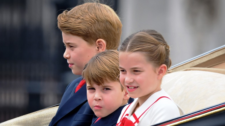 Kate Middleton and Prince William kids in a chariot