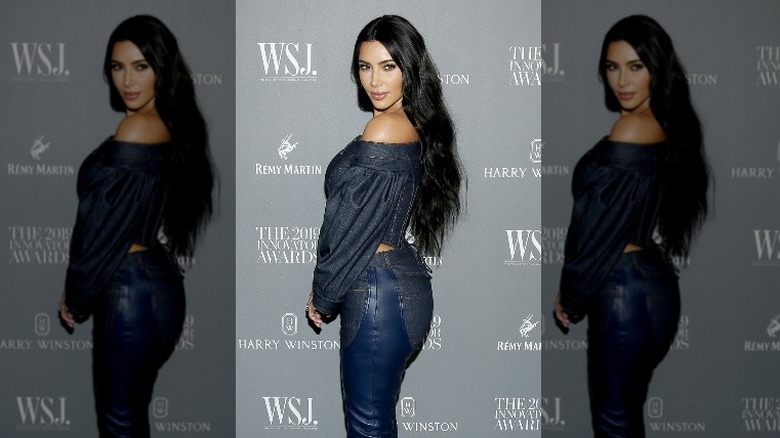 Kim Kardashian, showing off an idea of the perfect body type at the time