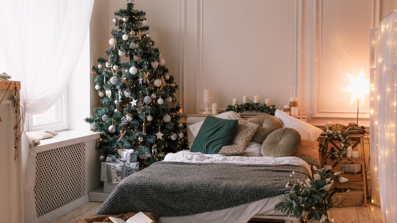 Christmas tree in bedroom corner